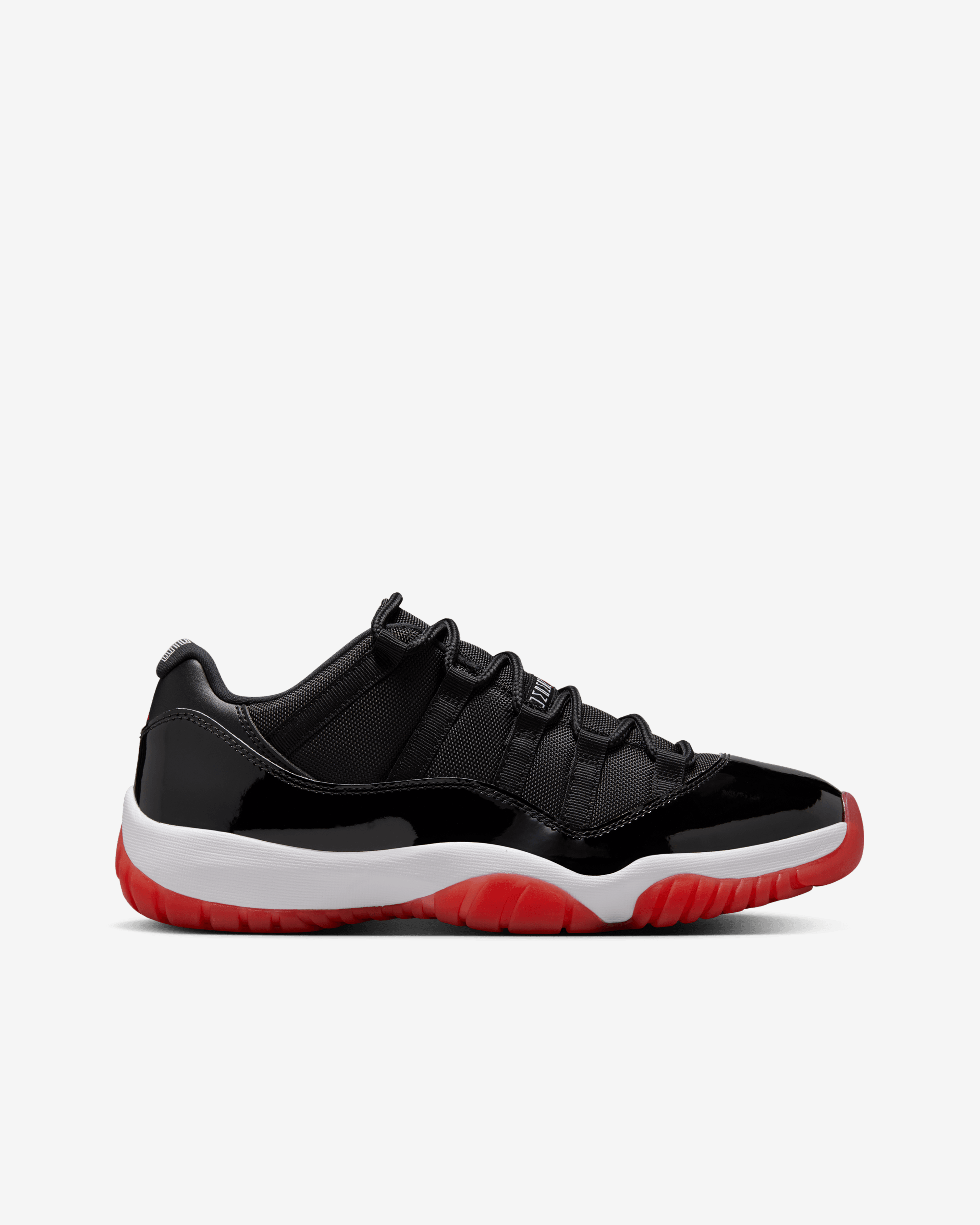 black red and white jordan 11 low top