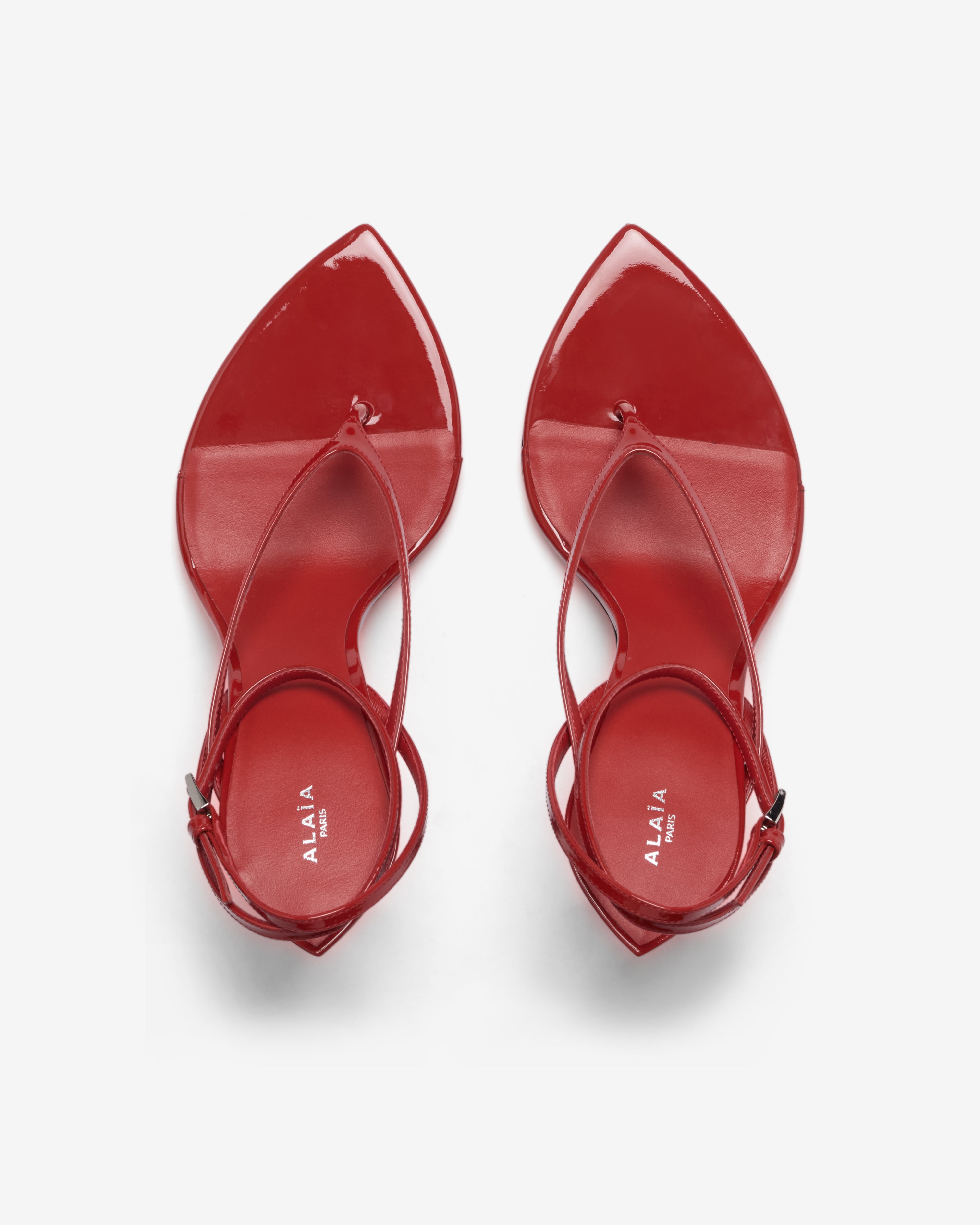 Alaïa: Women's invisible Thong Sandals (Burnt Orange) | Dover