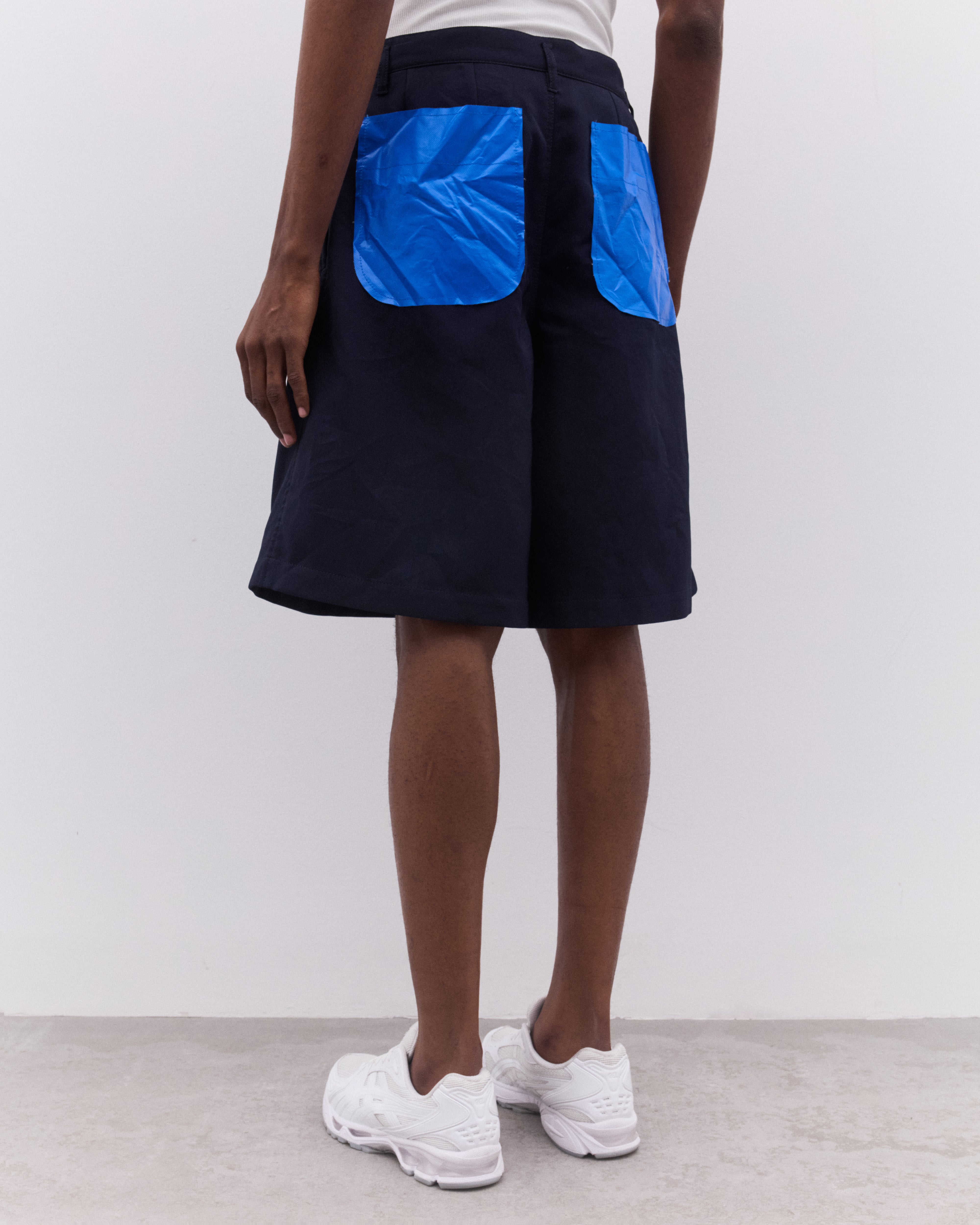 CDG Shirt: Men's Pleated Shorts (Navy) | Dover Street Market London