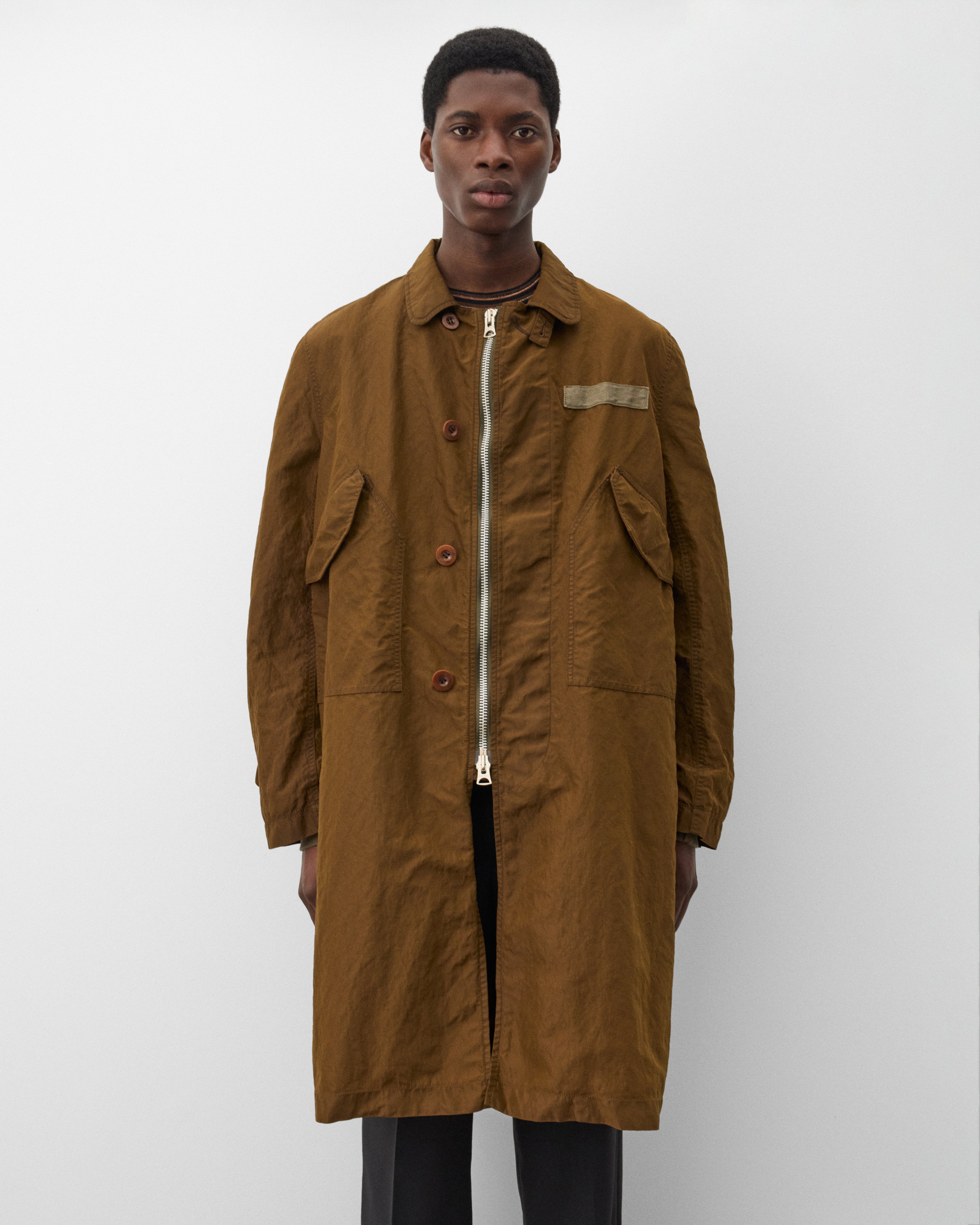 Sacai: Men's Treated Nylon Twill Coat (Green) | Dover Street
