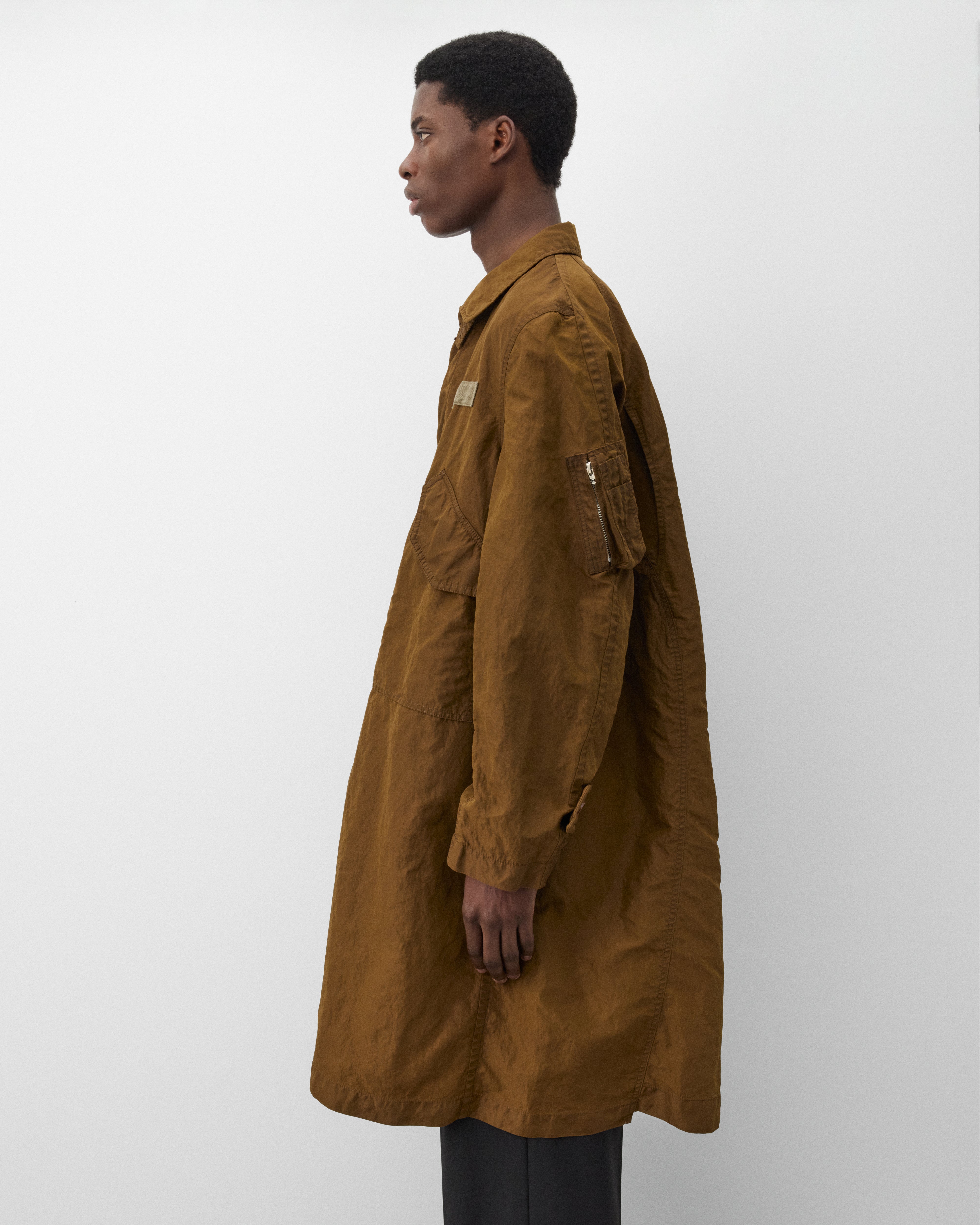 Sacai: Men's Treated Nylon Twill Coat (Green) | Dover Street