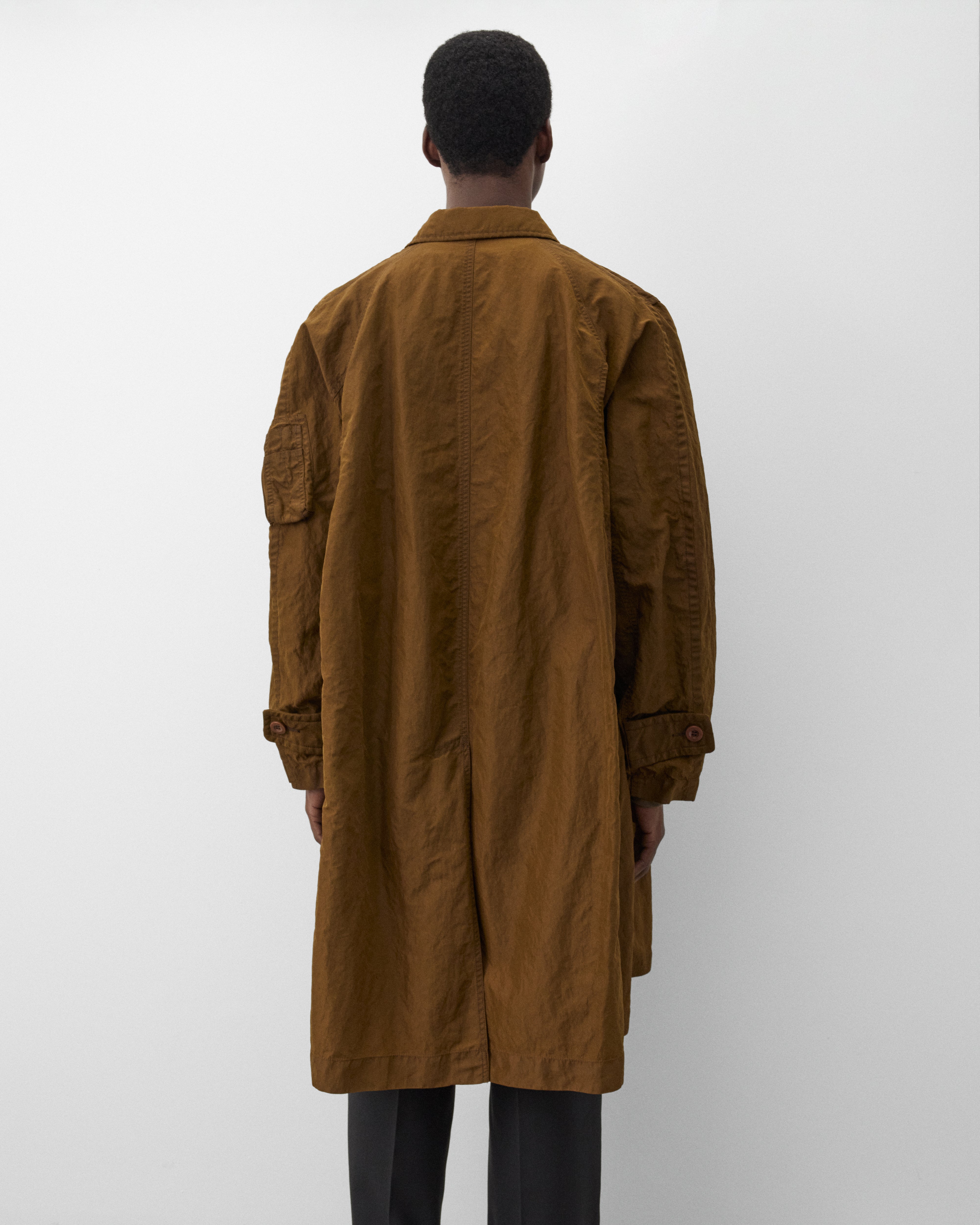 Sacai: Men's Treated Nylon Twill Coat (Green) | Dover Street