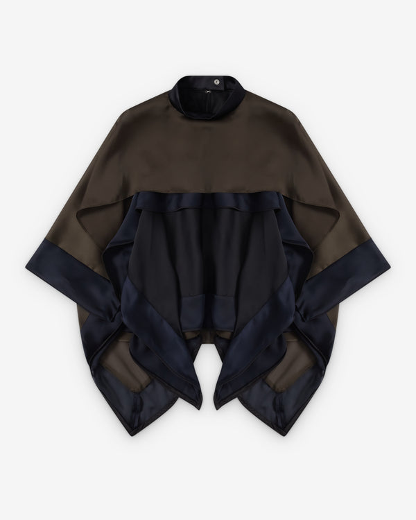 A sacai color-blocked poncho-style top with a dark brown upper section, a black ruffled midsection, and dark navy satin-trimmed wide sleeves and hem, shown flat on a light gray background.